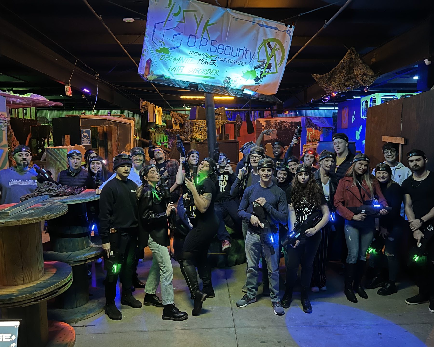 A corporate group in laser tag gear filling the Combat Ops arena