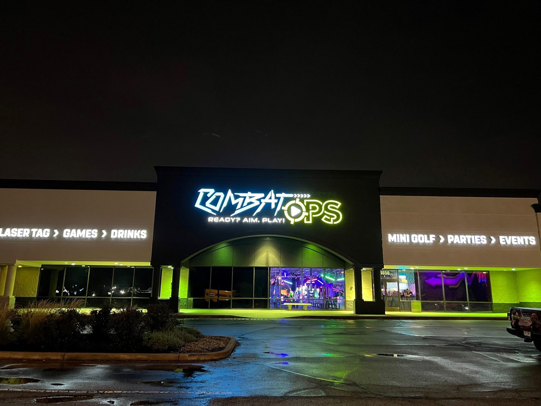 The Combat Ops building on E Southport Road lit up at night