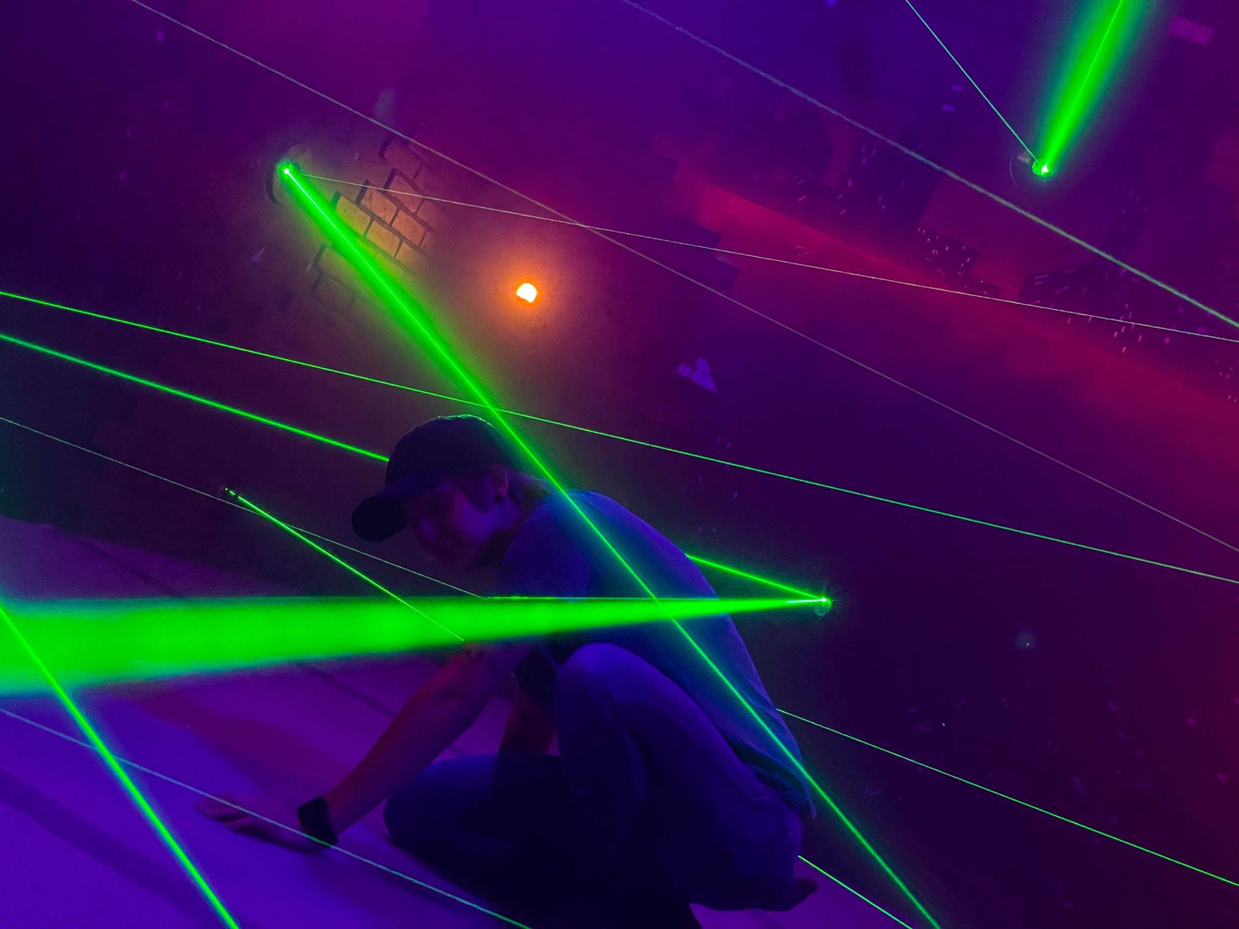 Green beams criss-crossing the Combat Ops laser maze